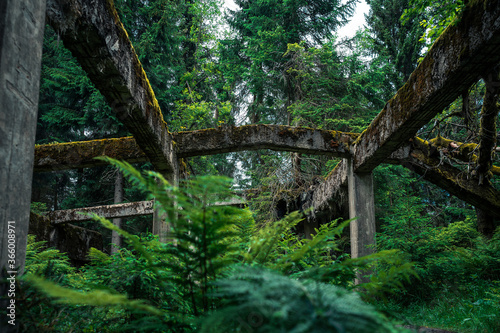 Crumbling concrete constructions of former tin mine Rolava and prison camp Sauersack near Prebuz, Krusne Hory, Czech Republic photo