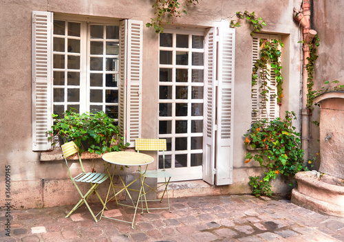 Paris, France, traditional French windows and door from back yard of traditional house in city center