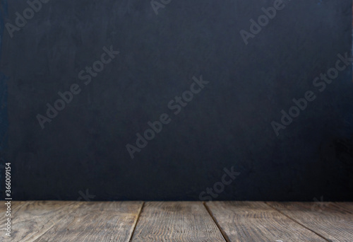Blank black Chalkboard Background. Empty Wooden table. back to school concept. Copy space