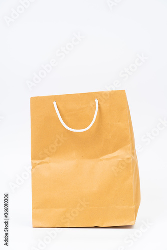 Shopping bag made from recycle paper on white background