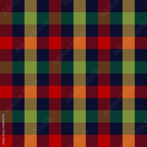 Christmas gingham in blue, red, green, yellow. Seamless multicolored check plaid striped vichy tartan graphic for New Year tablecloth or other modern festive winter textile print.