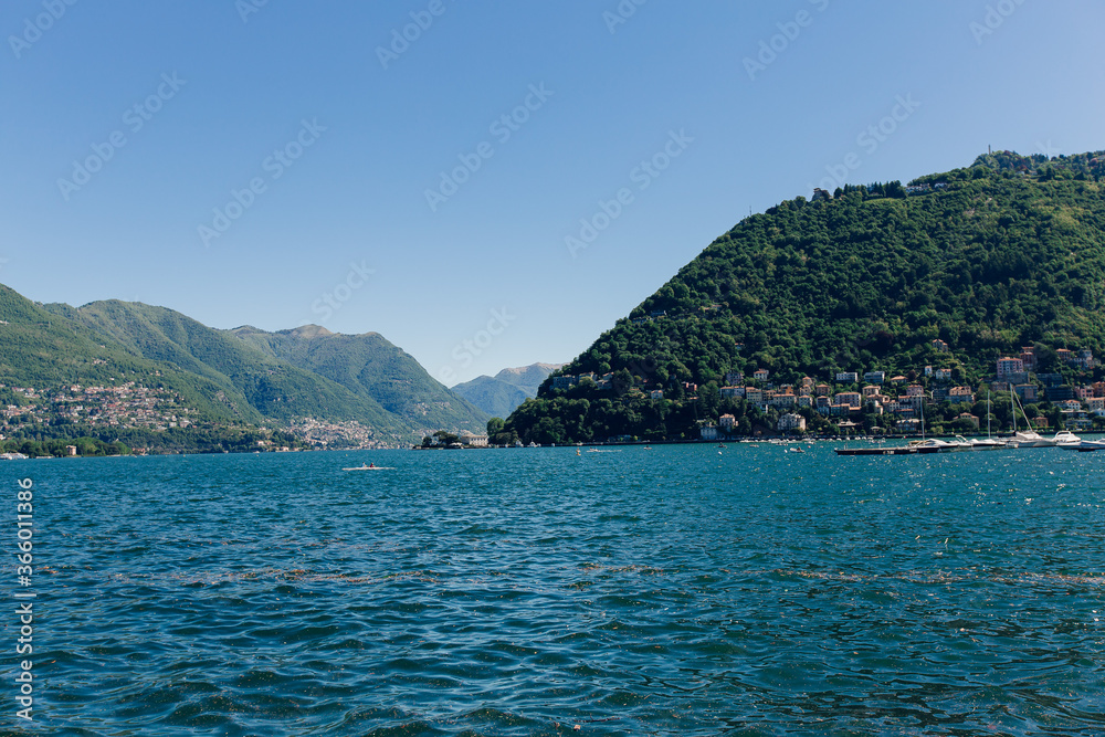 big green mountain surrounded by a lake