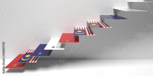 Flag of Malaysia on bank cards as stairs of a staircase. Consumer loans related 3D rendering