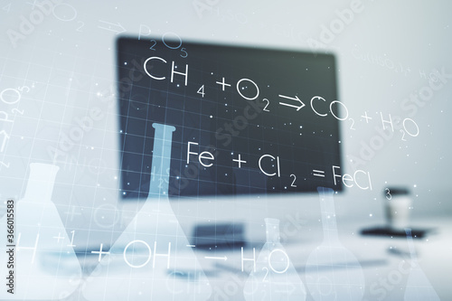 Creative chemistry concept on modern laptop background. Multiexposure