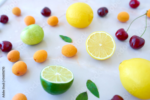Bright tasty fruits and berries. Healthy nutrition, summertime concept. Colorfull backdrop