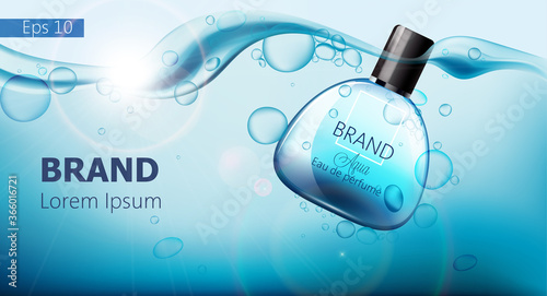 Bottle of perfume sinking in blue water with air bubbles