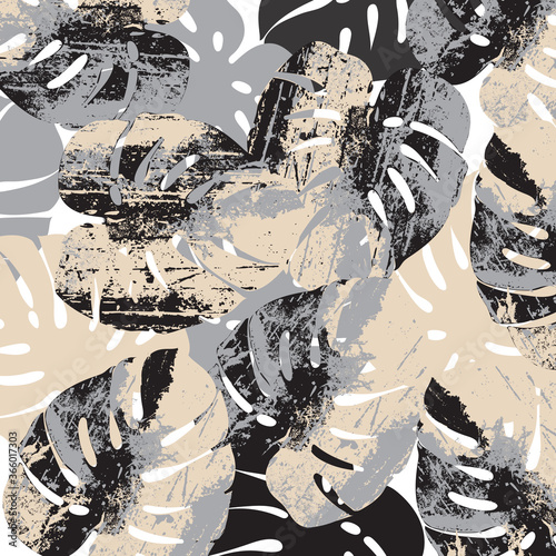 Big palm leaves pattern. Grunge design. Beat up, scratched style