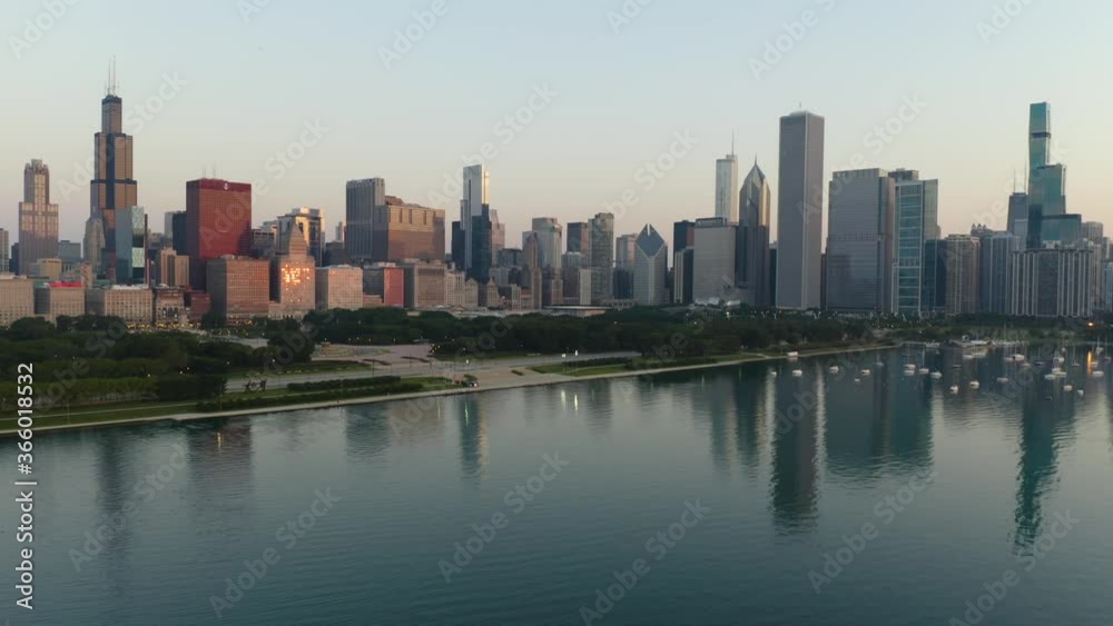 Aerial, Establishing Shot of Iconic Chicago Skyline as Drone Circles Over Lake Michigan