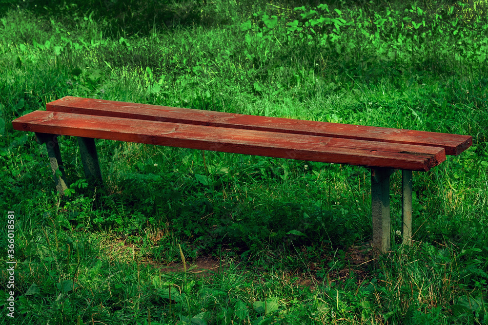 Fototapeta premium Old wooden bench in red