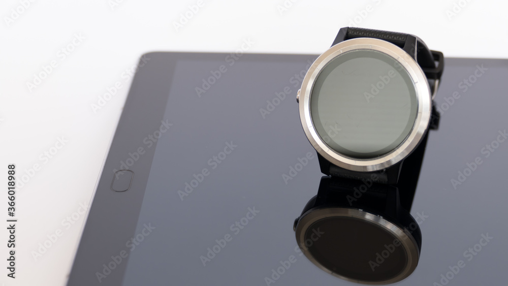 smart round watch isolated on a mirror board smart round watch isolated on a mirror board
