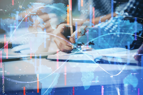 Wallpaper Mural Double exposure of Man writing in notepad with business icons on background. Torontodigital.ca