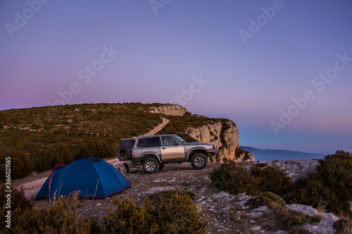 Winter sunset and 4x4 car in Serra Del Montsec, Lleida, Spain