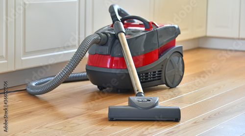 Cuadro en lienzo Canister vacuum cleaner for home use on the floor
