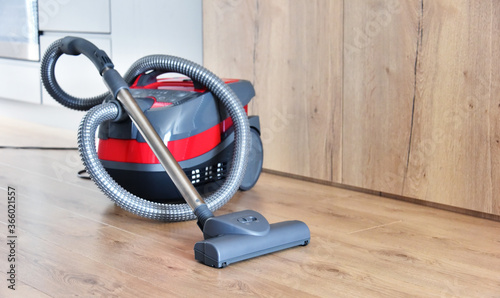 Canister vacuum cleaner for home use on the floor