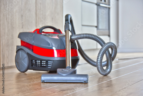 Canister vacuum cleaner for home use on the floor