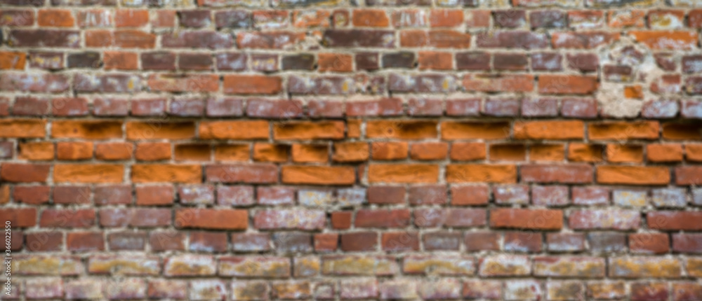 Fototapeta premium Blur background of old red brick wall 
