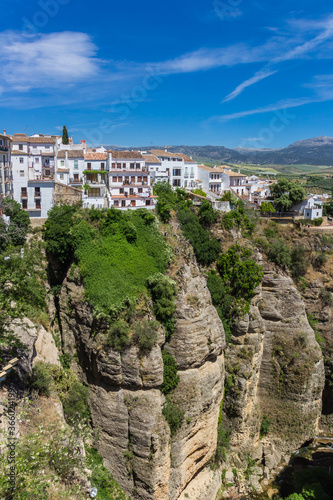 White houses and surrounding landscape of historic city Ronda, Spain