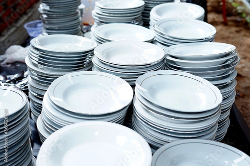 Stacked white ceramic plates on the table