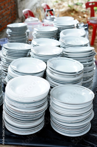 Stacked white ceramic plates on the table