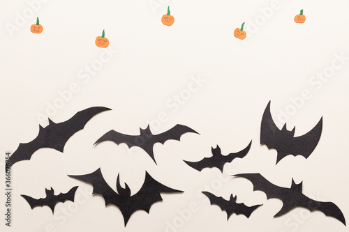 Black bats paper cut background. © uv_group