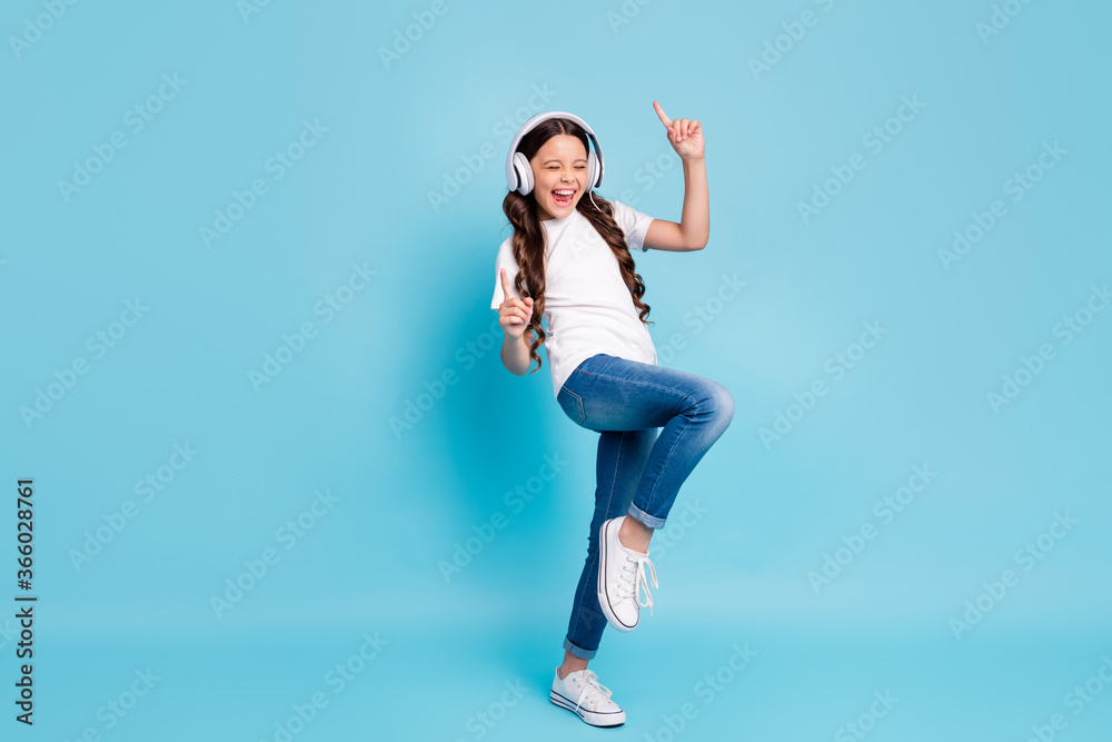 Full length body size view of nice glad excited cheerful wavy-haired girl meloman listening stereo single dancing isolated on bright vivid shine vibrant blue teal turquoise color background