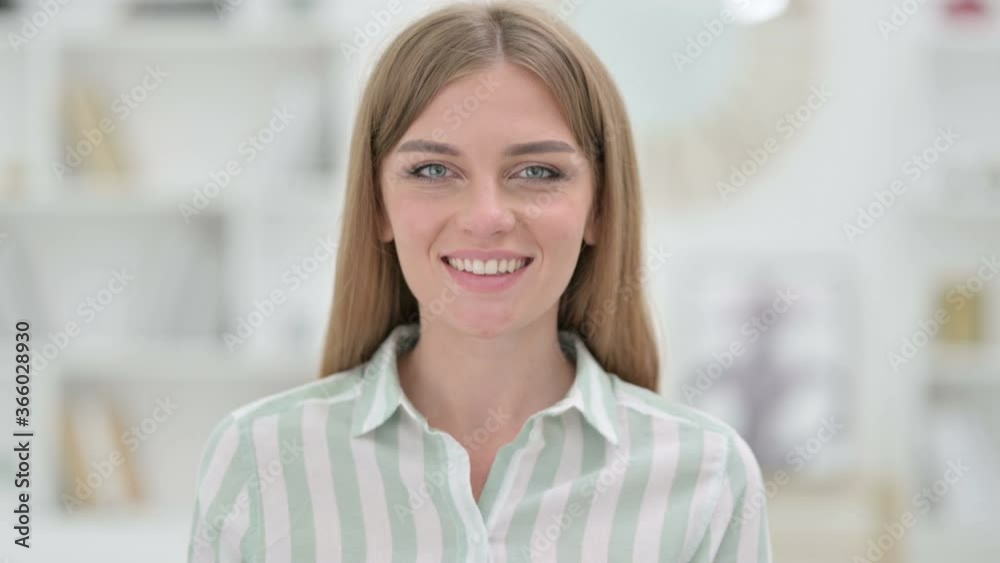 Portrait of Loving Young Woman giving Flying Kiss with Hand Portrait of Loving Young Woman giving Flying Kiss with Hand