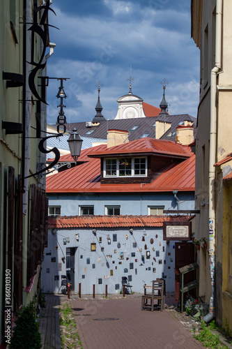 Streets of the old city Vilnius Narrow streets and beautiful facades. Citizens and tourists walk, sit in cafes and see the sights of the city Summer 2020, after quarantine. Walk in the city. Good mood