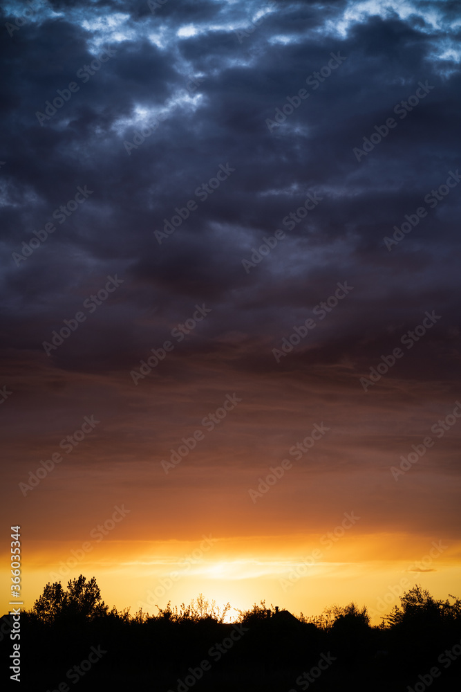 dramatic sunset over the clouds