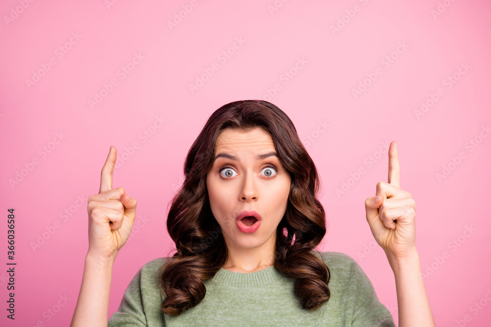 Portrait of astonished girl point index finger copyspace indicate wonderful adverts promotion impressed scream wow omg wear good look jumper isolated over pastel color background Portrait of astonished girl point index finger copyspace indicate wonderful adverts promotion impressed scream wow omg wear good look jumper isolated over pastel color background
