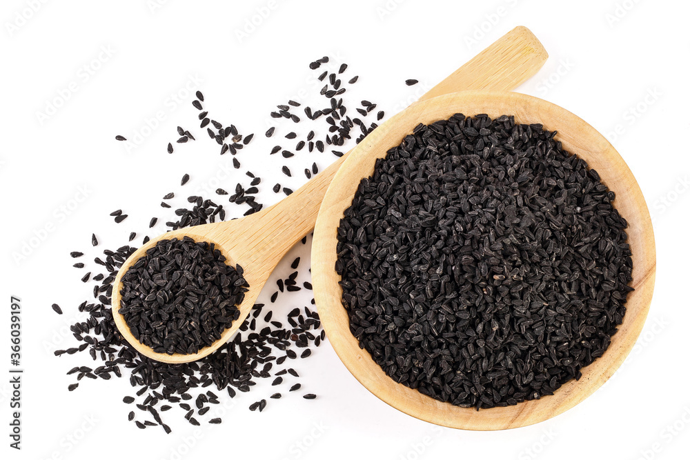 Nigella sativa or Black cumin in wooden bowl isolated on white background. Top view. Flat lay. Nigella sativa or Black cumin in wooden bowl isolated on white background. Top view. Flat lay.