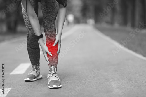 Shin Splints Injury. Female Athlete Massaging Injured Leg, Suffering Trauma During Jogging