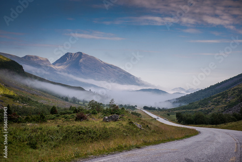 Empty road. road to clouds. rocky road goes into the distance into the blue sky. Beautiful Norway landscape, Travel in Norway