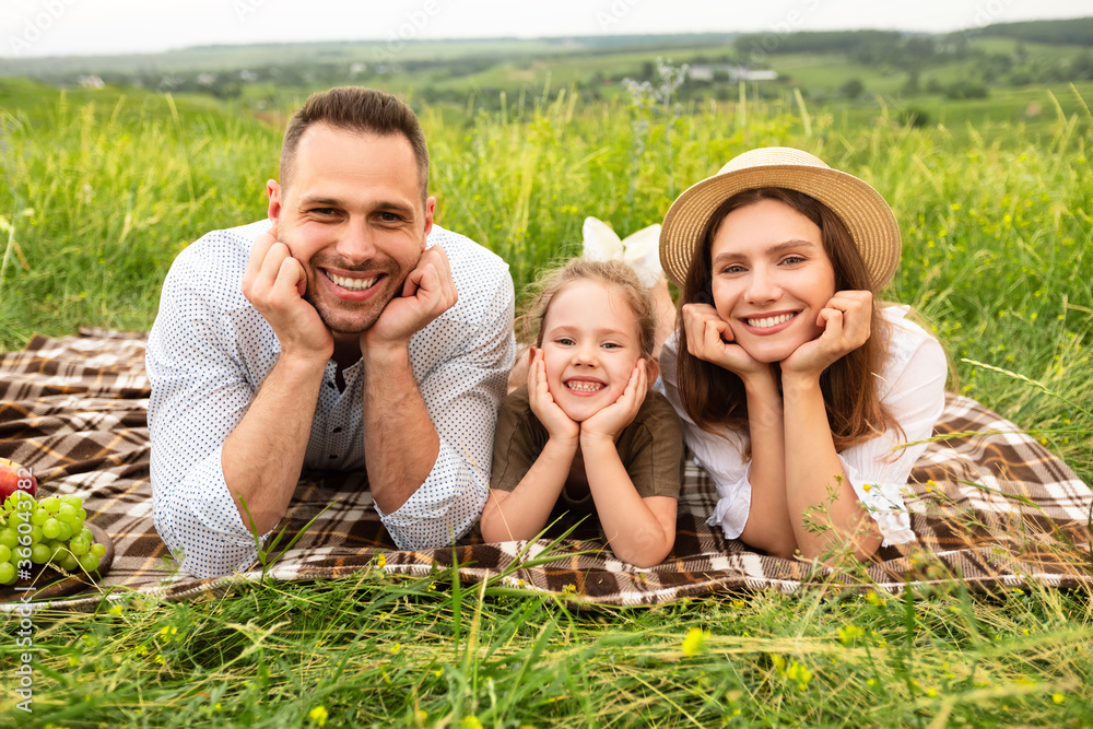 Cute family spending time together in the meadow Cute family spending time together in the meadow