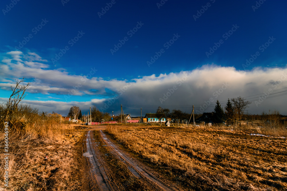 Road in Russian village during snowless winter