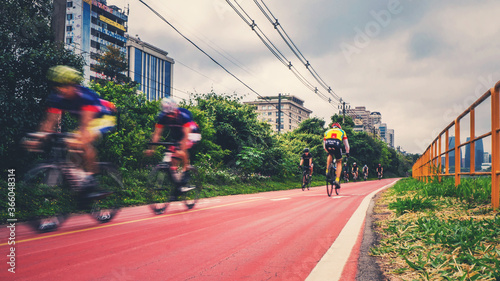 cyclists pedaling at speed on the bike path in são paulo