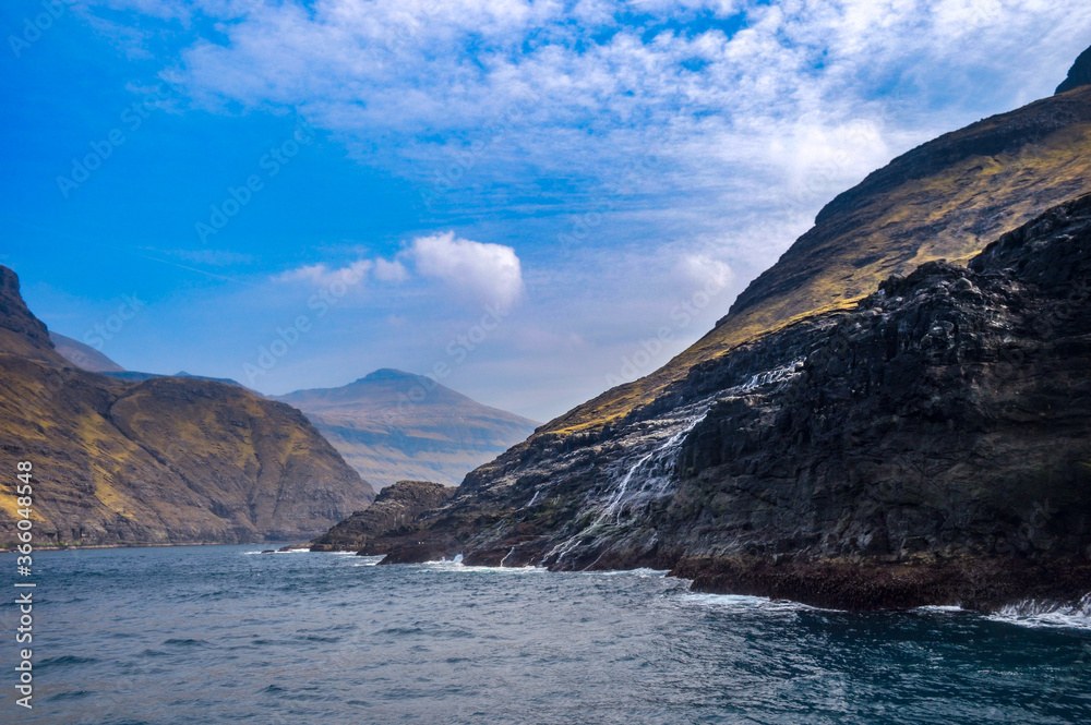 Amazing view in Faroe Islands (Denmark, Europe). Beautiful Panoramic Scene Of Nordic Islands Amazing view in Faroe Islands (Denmark, Europe). Beautiful Panoramic Scene Of Nordic Islands