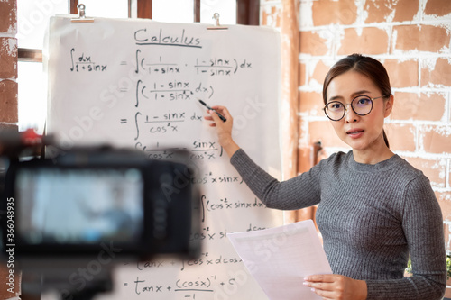 Asian woman teacher teaching lesson online learning via internet at home, self study and e-learning new normal concept photo