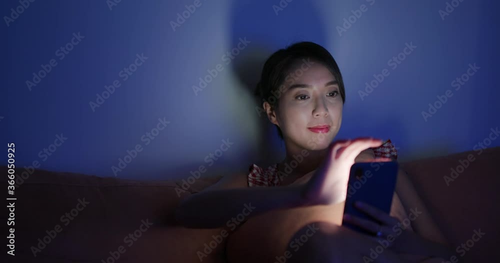 Woman use of cellphone at night Woman use of cellphone at night