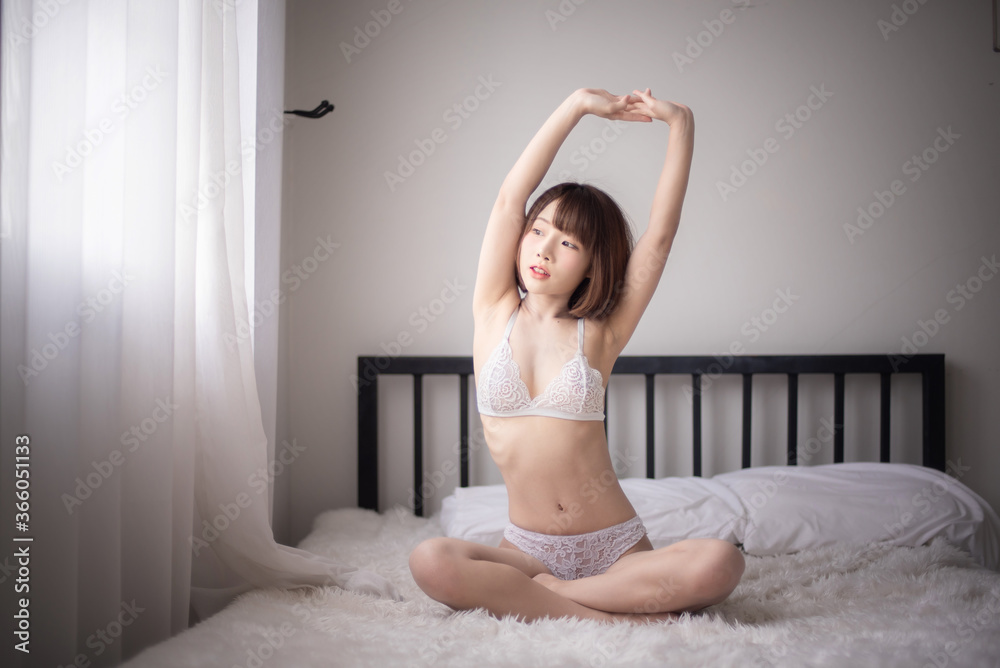 Bikini. Asian women wearing bikinis, posing in a studio room. Bikini. Asian women wearing bikinis, posing in a studio room.