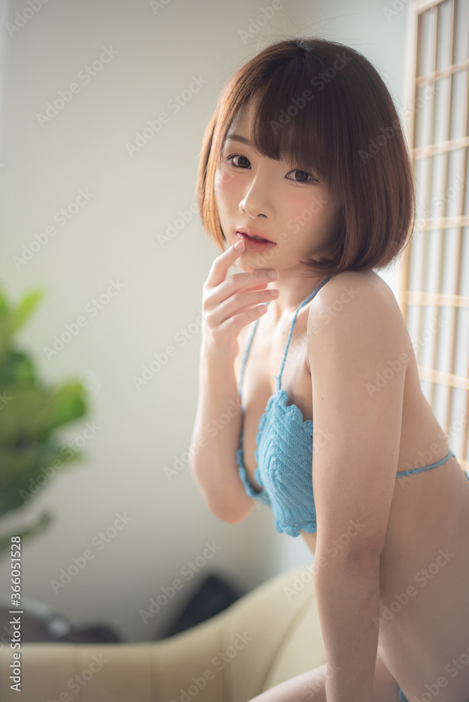 Bikini. Asian women wearing bikinis, posing in a studio room. Bikini. Asian women wearing bikinis, posing in a studio room.