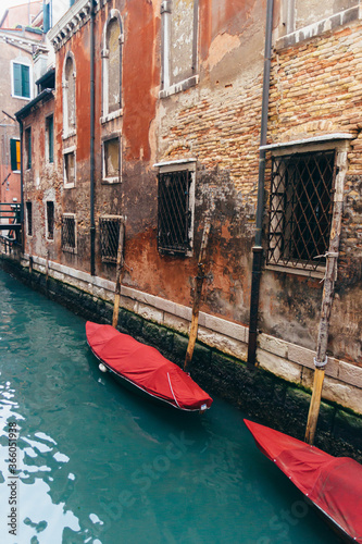 Traditional Venice Cityscape with narrow canal, gondola