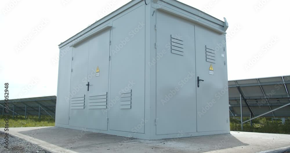 Cloudy sky and solar panels in the background of a transformer, 4k Cloudy sky and solar panels in the background of a transformer, 4k