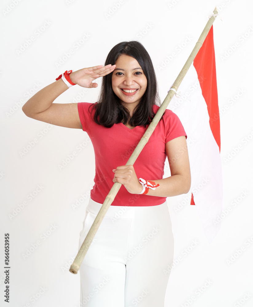beautiful indonesian woman salute gesture while holding indonesia flag beautiful indonesian woman salute gesture while holding indonesia flag