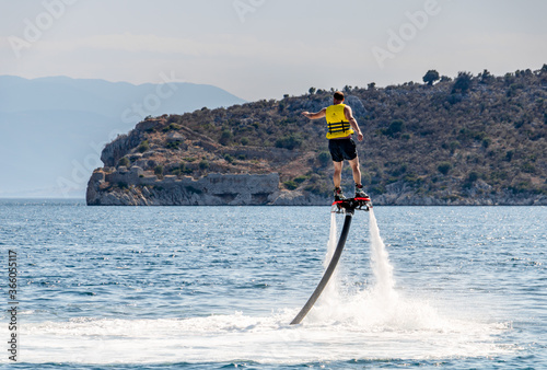 Man practicing flyboard at Kondyli beach Greece