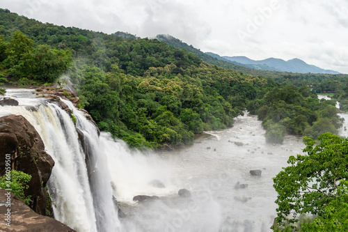 Beautiful nature view during Mansoon time with full filled water fall and green forest from the famous tourist place in Kerala  India called Athirappalli  Vaazhachaal