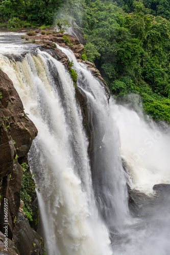 Beautiful nature view during Mansoon time with full filled water fall and green forest from the famous tourist place in Kerala  India called Athirappalli  Vaazhachaal