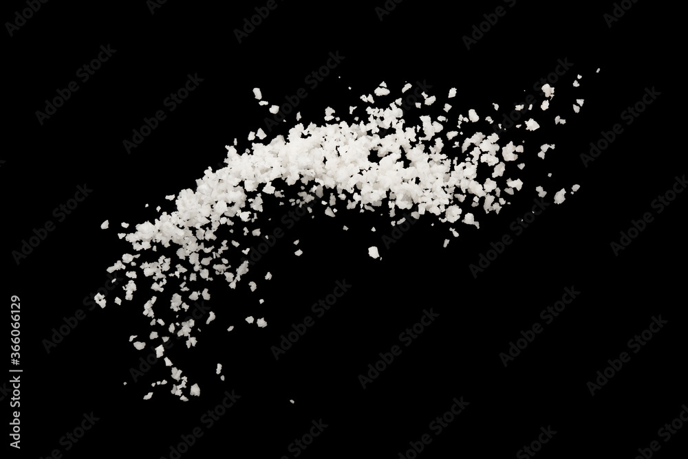Salt splash explosion isolated on black background , freeze stop motion Salt splash explosion isolated on black background , freeze stop motion