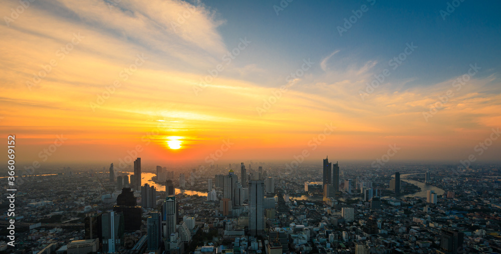 Aerial view of Bangkok City skyscrapers and blue sky the sunset background with King Power MahaNakhon viewpoint