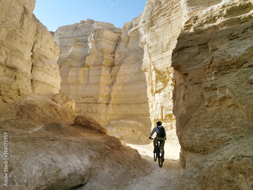 Mountain Bicyclist in cyclist in the creek gorge photo