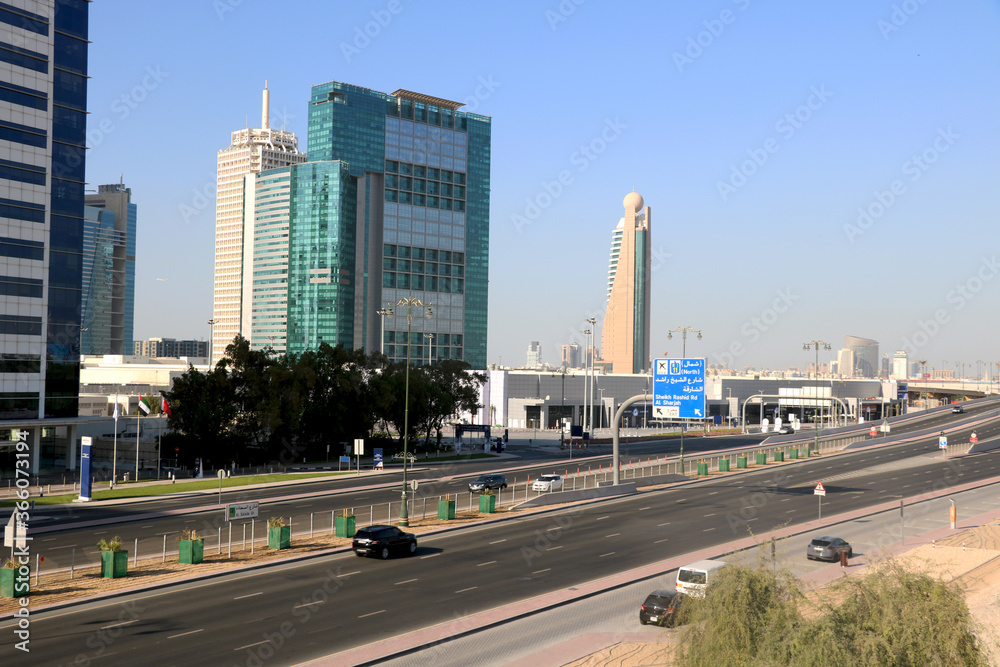 aerial view of highway road in Dubai with background of big modern building aerial view of highway road in Dubai with background of big modern building